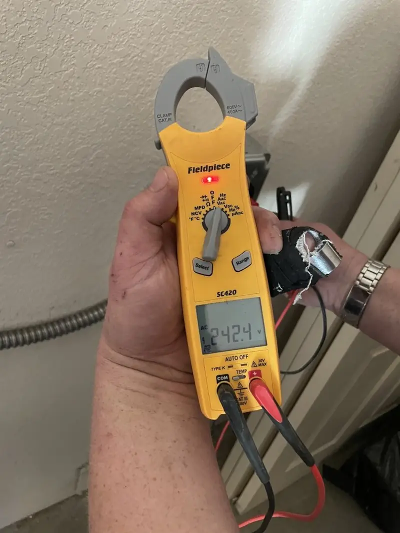 Voltage testing with clamp meter during Ceiling Fan Installation in Scotch Plains